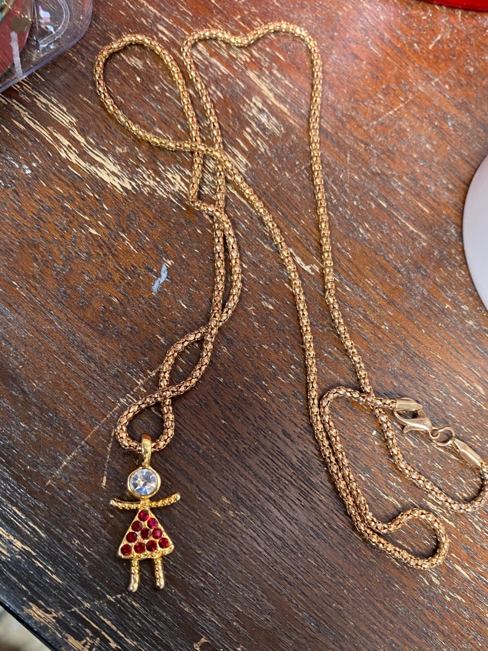 Gold-Tone Girl Pendant Necklace with Red Crystal Dress